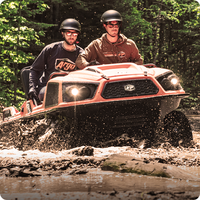 orange Argo XTV charging through mud